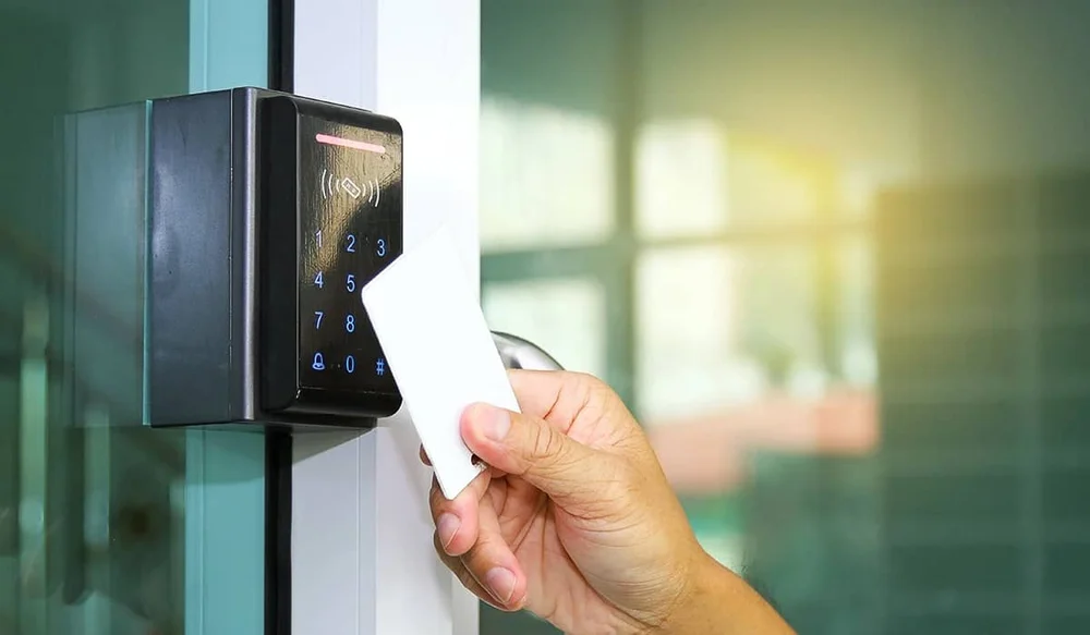 Employee using NFC ID card for office access control